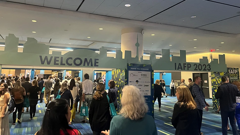 IAFP 2023 attendees make their way to the exhibit hall for a wine and cheese reception on day one of the annual meeting.