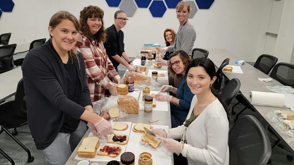 Nelson-Jameson employees Tonya Schlagenhaft, Kim Krause, Amanda Hill, Kelly Zirbel, Traci Burkart, Betty Wrege and Devany Rindy pack lunches to support the Marshfield Area United Way Nutrition on Weekends program.