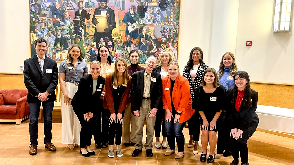 James F. Evans meets with current agricultural communications students in October 2023.