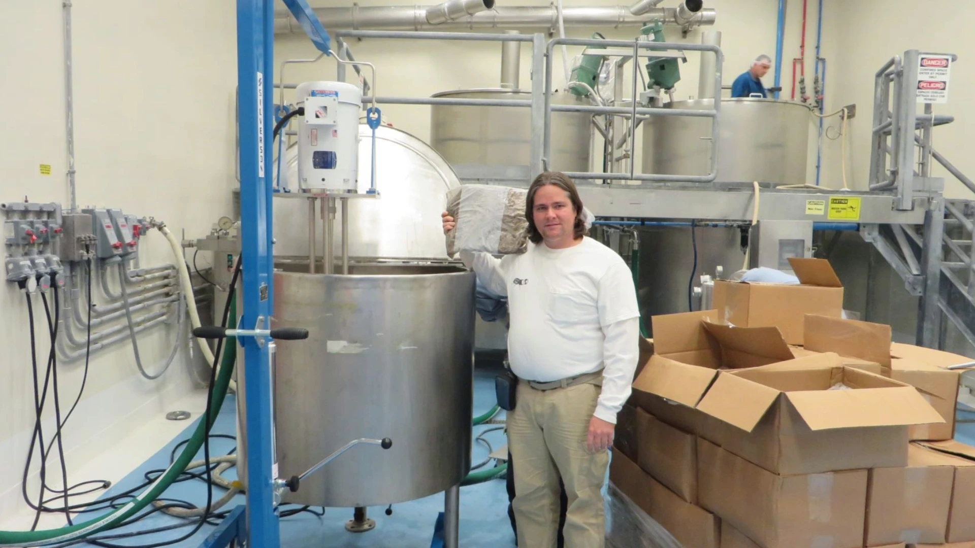 All Things Bugs Founder Aaron T. Dossey using his patented spray drying process to manufacture Griopro cricket powder.